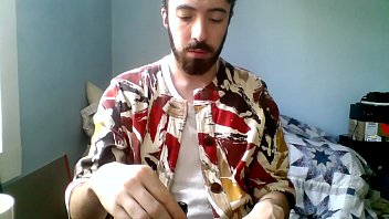 Young gay guy paints his nails while trying not to think about donald trump