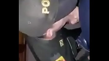 Uniformed Police Officer Sucking Colleague