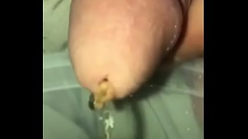Close up piss in a cup