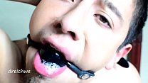 Very tight gag in the mouth with saliva