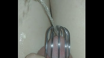 sissy pissing herself again with a new chastity