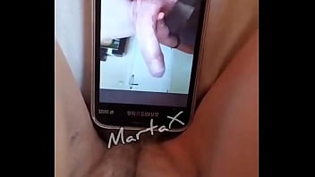 MartaXvideos: I masturbate looking at a photo on my cell phone of a rich cock and I talk dirty
