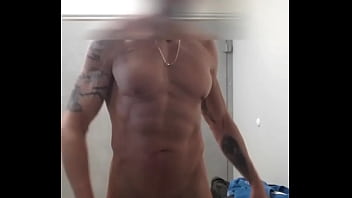 muscled guy jerks off and cums in gym locker room