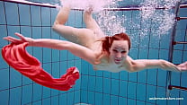 Adorable brunette teen swimming naked